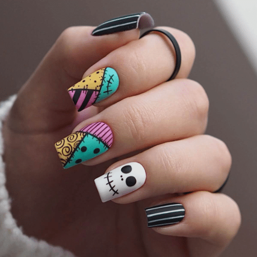 How can I incorporate Halloween elements into a professional-looking manicure?