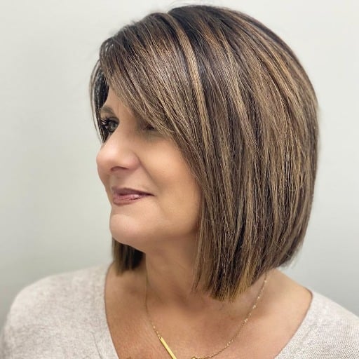 How can I style my short hairstyles for thick hair over 50 to look more youthful?