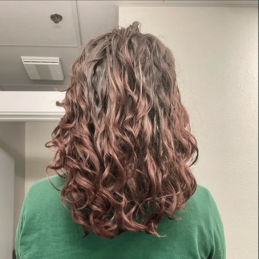 How can I make my wavy hair more manageable with the proper cut