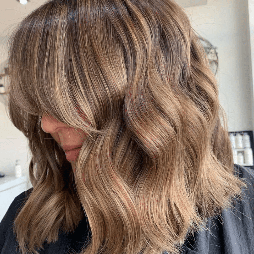 How can I style my medium-length wavy hair for a low-maintenance look