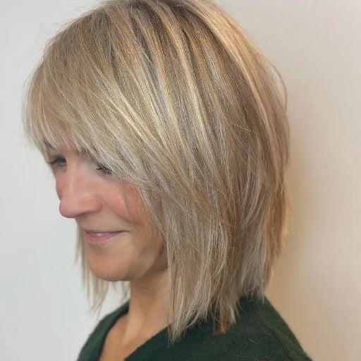 How can medium-length hairstyles flatter women over 50?