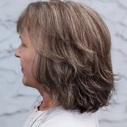 How can I add volume to my medium-length fine hair?