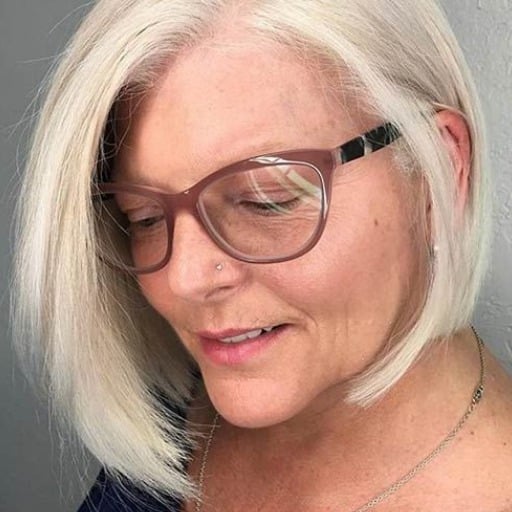 How can bangs complement medium-length hairstyles for older women?