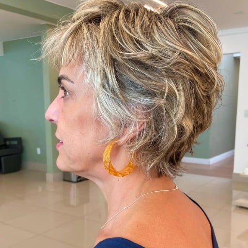 An invigorating short shag hairstyle for women over fifty featuring fine hair.