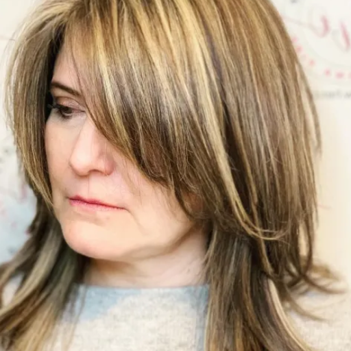 How Can Medium-Length Haircuts Frame the Face for Women Over 50?