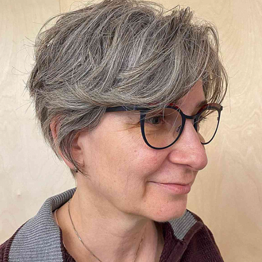 How can I choose a hair color that complements my short hairstyle and glasses?